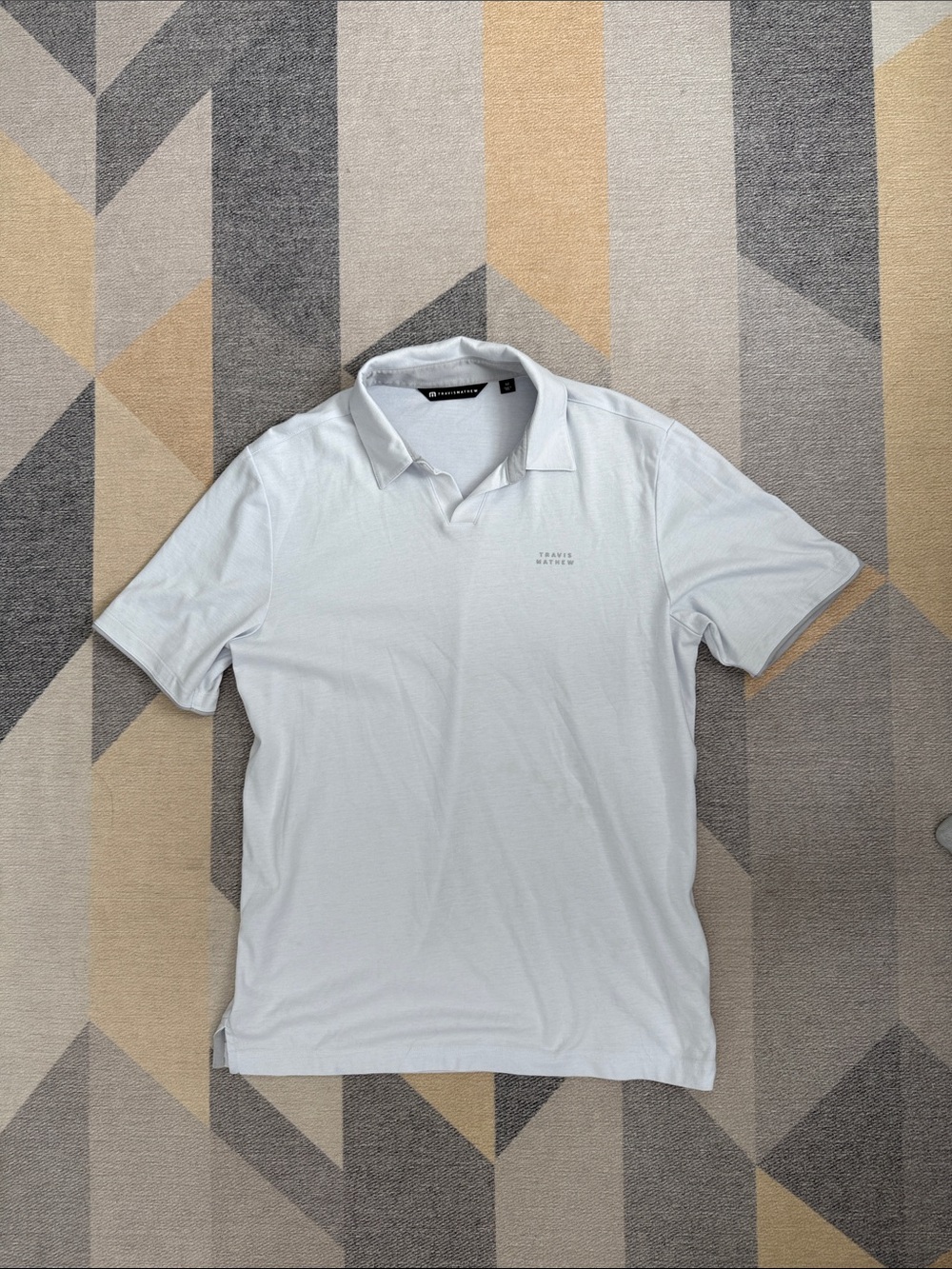 Travis Mathew White Men's Polo with Subtle Chest Logo